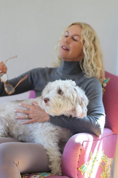 Trish Hart Holding A Dog